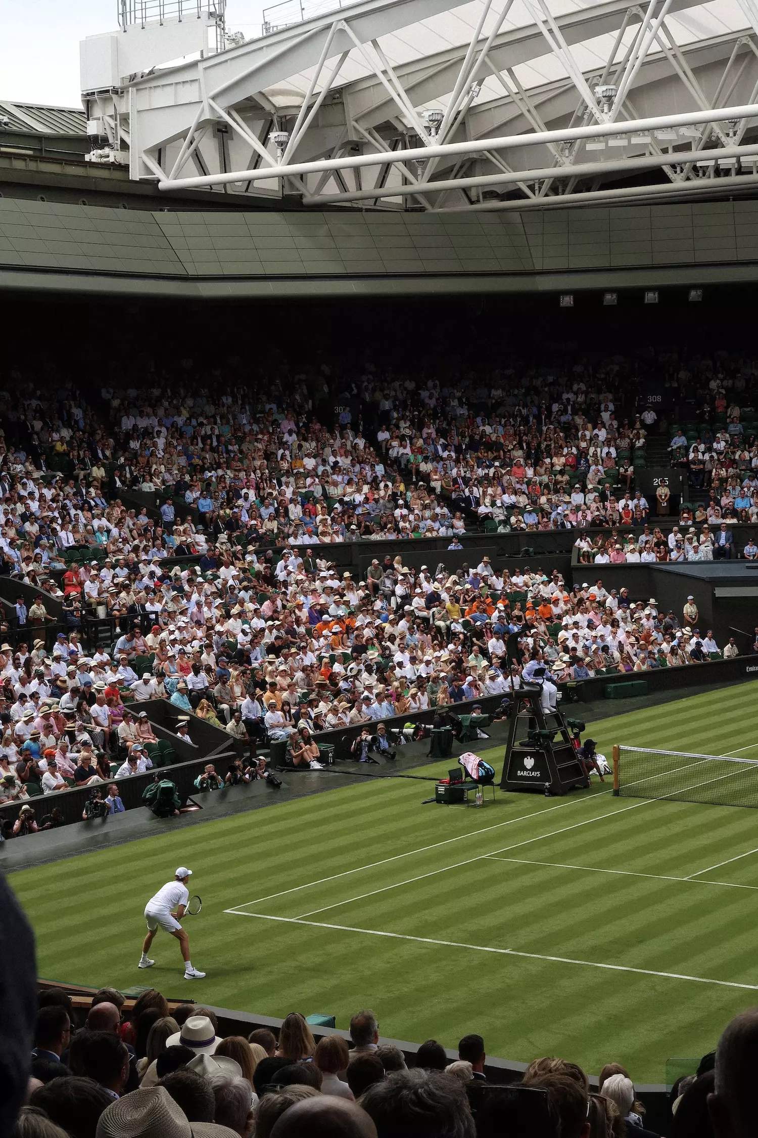 Wide shot of Centre Court, Day One at Wimbledon with Jannik Sinner