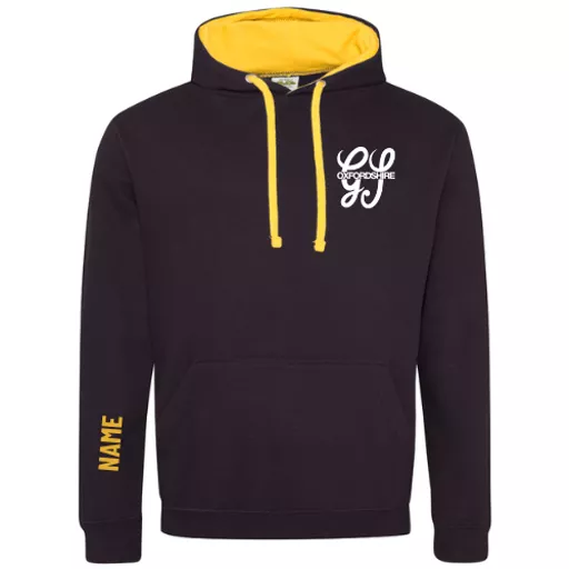 OxfordshireGangShow2026_AdultsOverheadVarsityHoodie_BlackGold_Front.png
