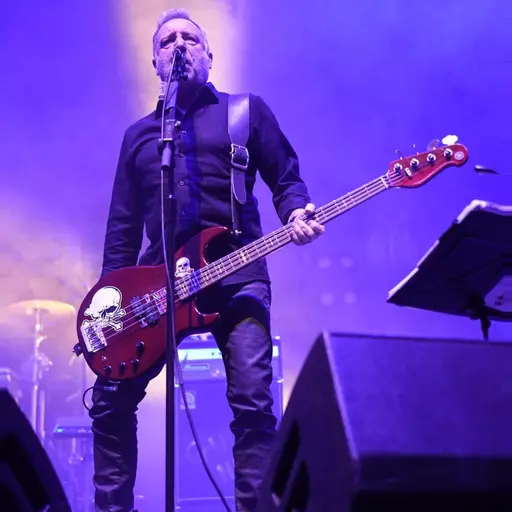 Peter Hook with black GS78 guitar strap 7-4-23 2.jpg