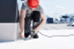 Leister Triac AT digital hot air welding gun in use.webp