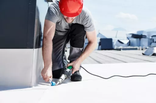 Leister Triac AT digital hot air welding gun in use.webp