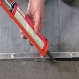 ClassicBond Aluminium EPDM Termination Bar being installed with sealant.jpg