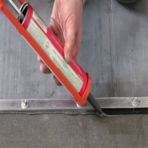 ClassicBond Aluminium EPDM Termination Bar being installed with sealant.jpg