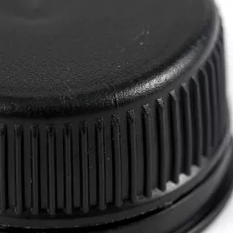 Black_bottle_cap_tamper_evident_202606020928.jpg