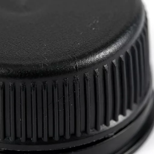 Black_bottle_cap_tamper_evident_202606020928.jpg