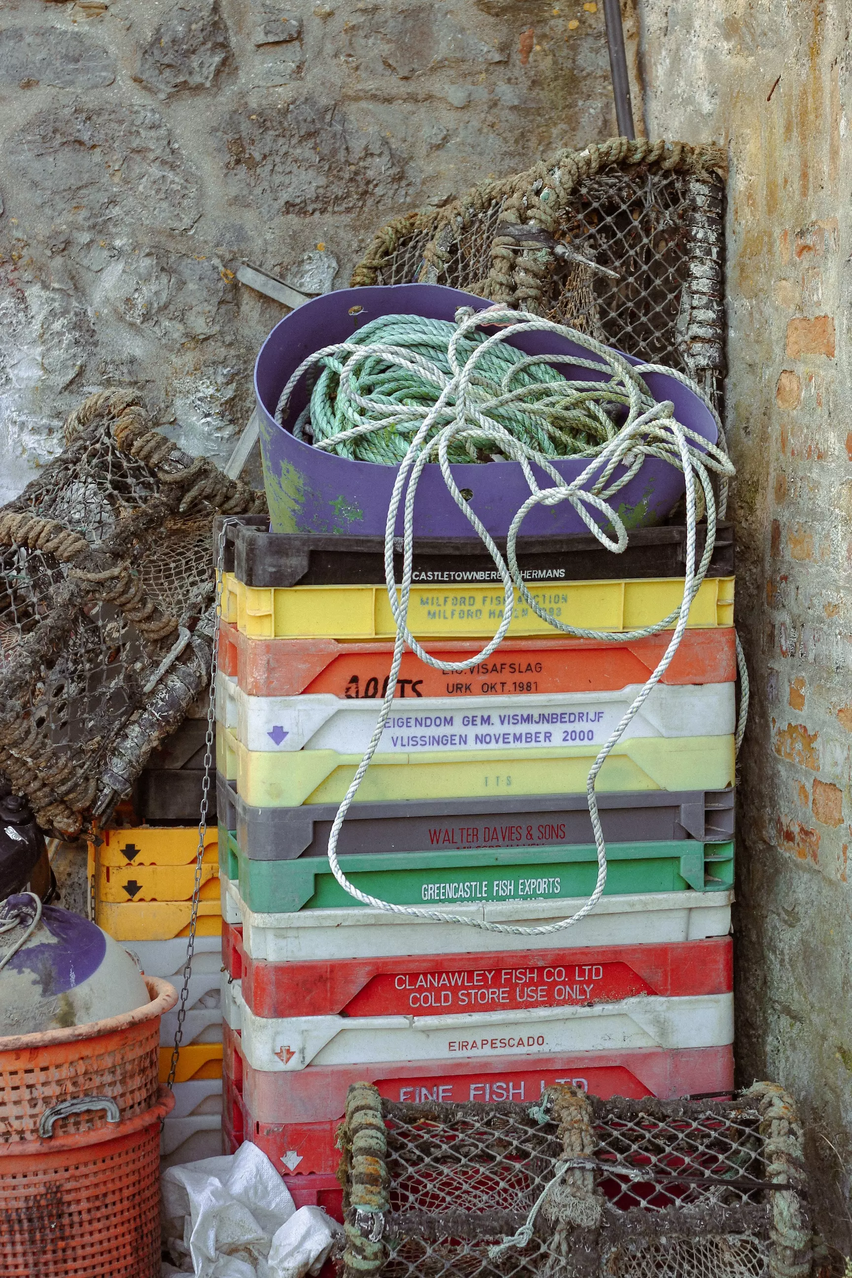 Stacked colourful boxes of fishing equipment