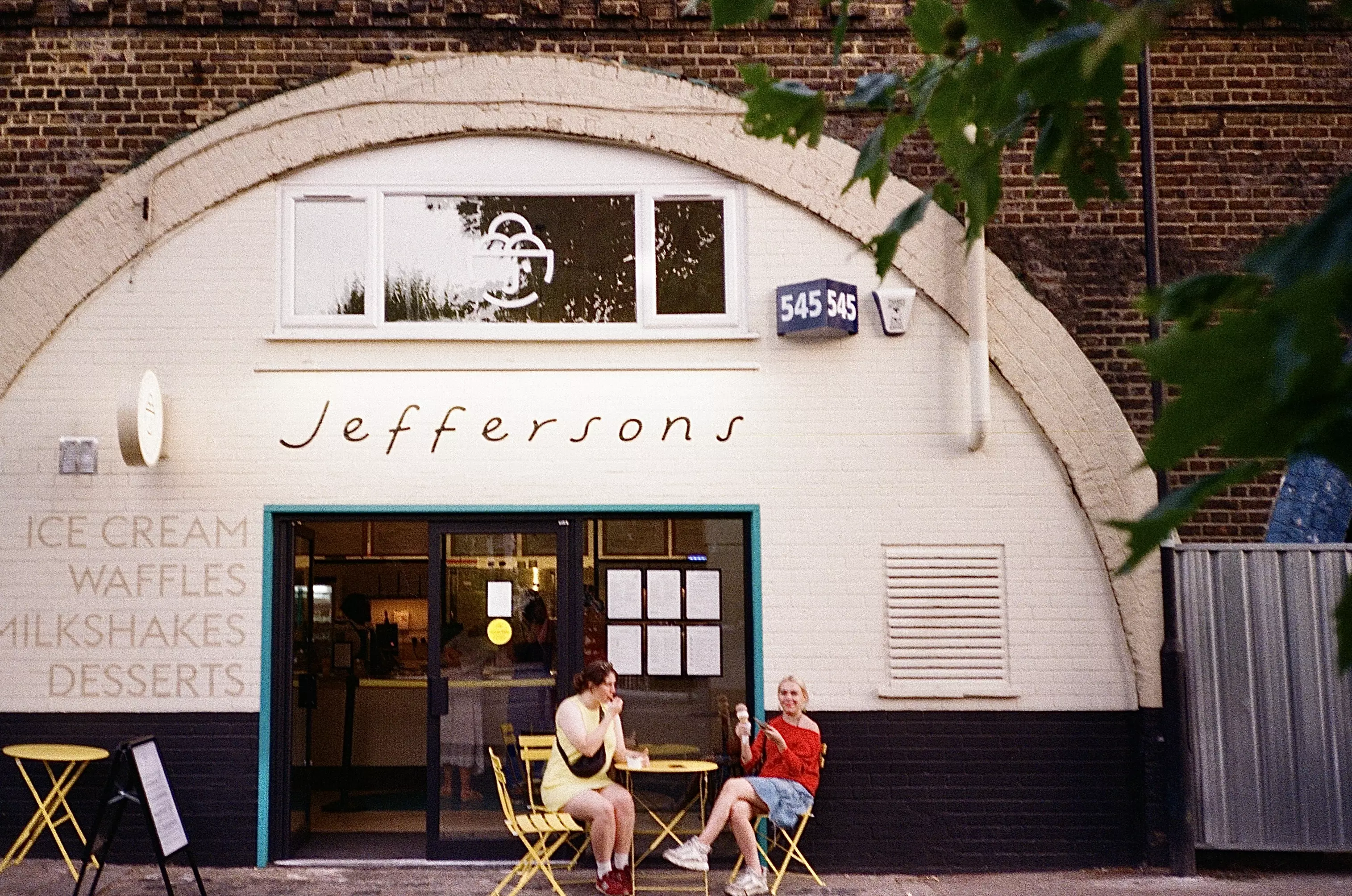 2 young female sat outside Jeffersons gelato in Brixton