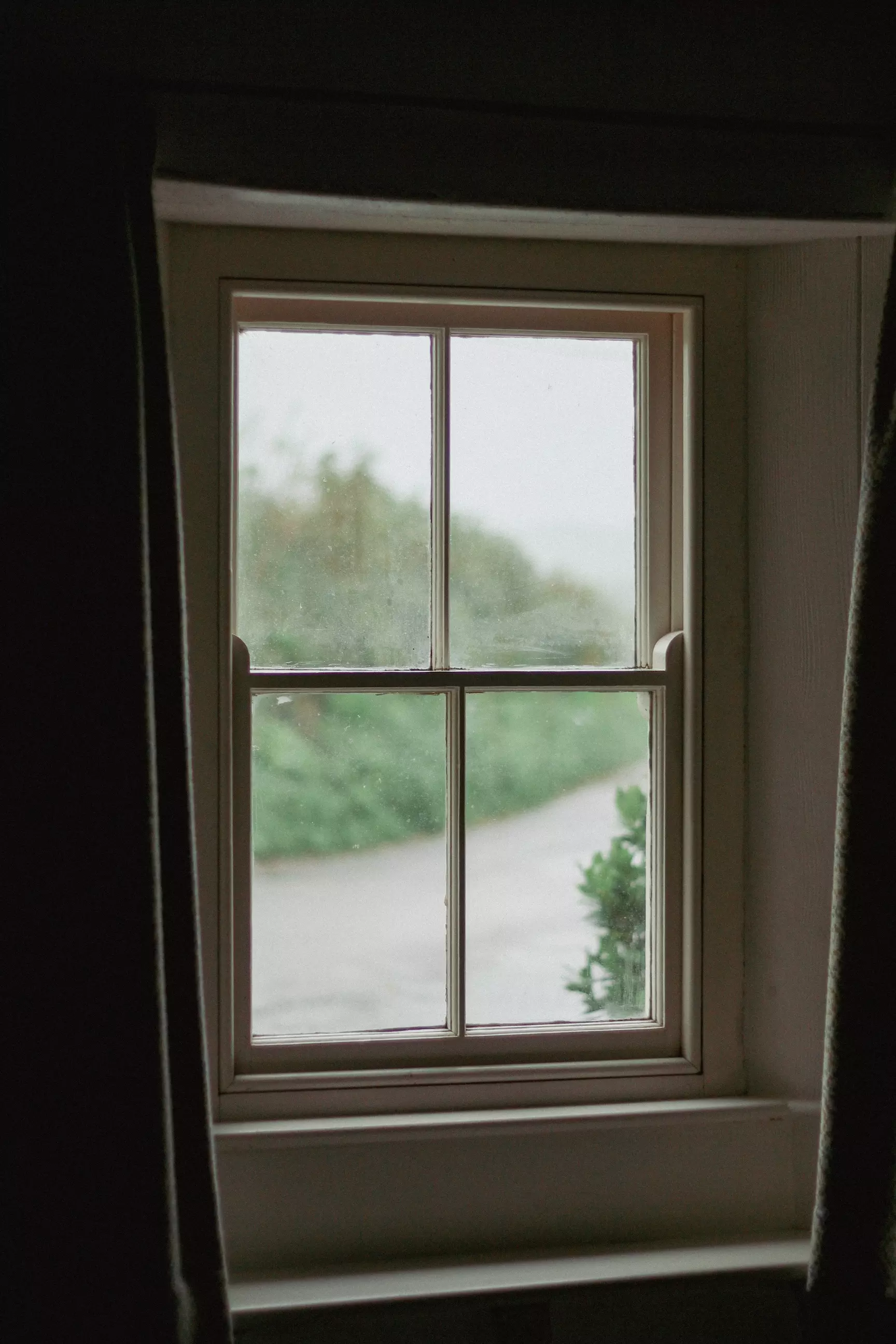 Window looking out to countryside roads