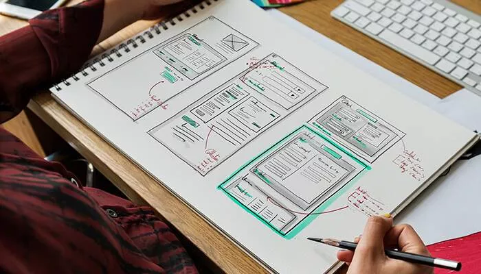 drawings of a website design plan on paper