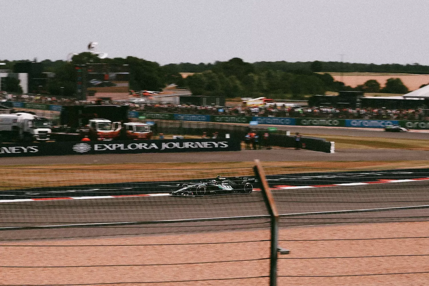 Mercedes Car driving at speed around the Silverstone Circuit