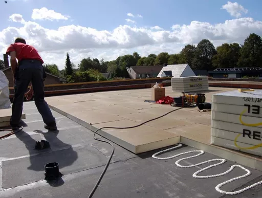 Recticel Powerdeck U flat roof insulation board Installation underway.webp