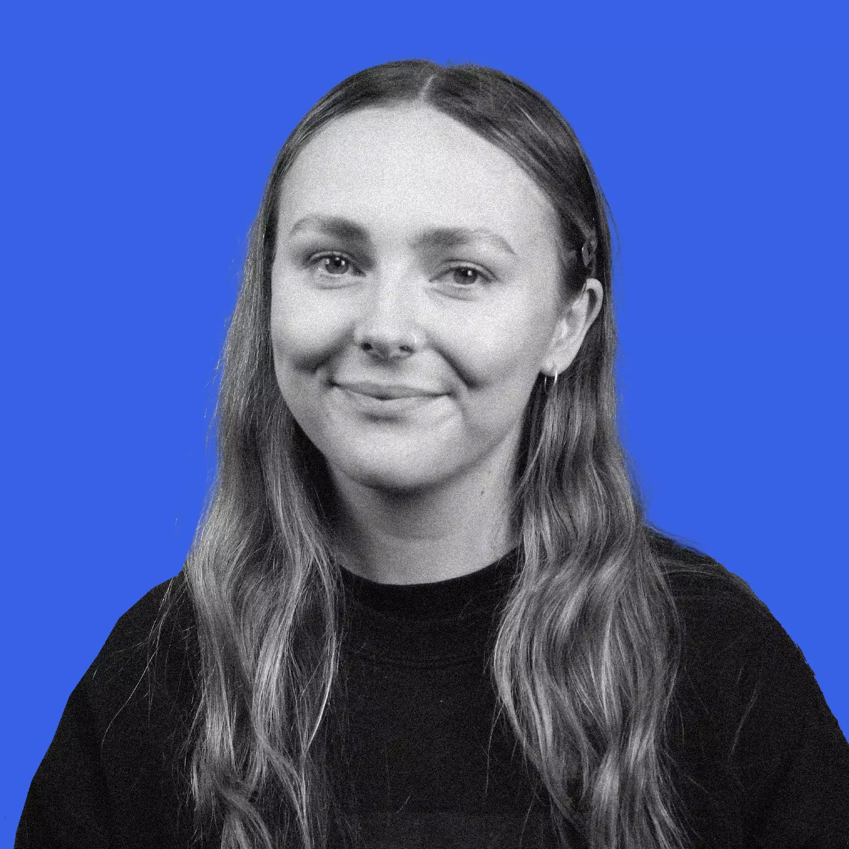 Black and white headshot of Kyanna Cleave on a blue background