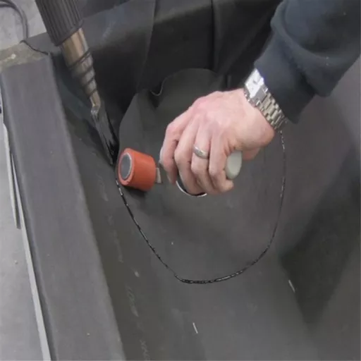 RESITRIX Drain Outlet being installed.jpg