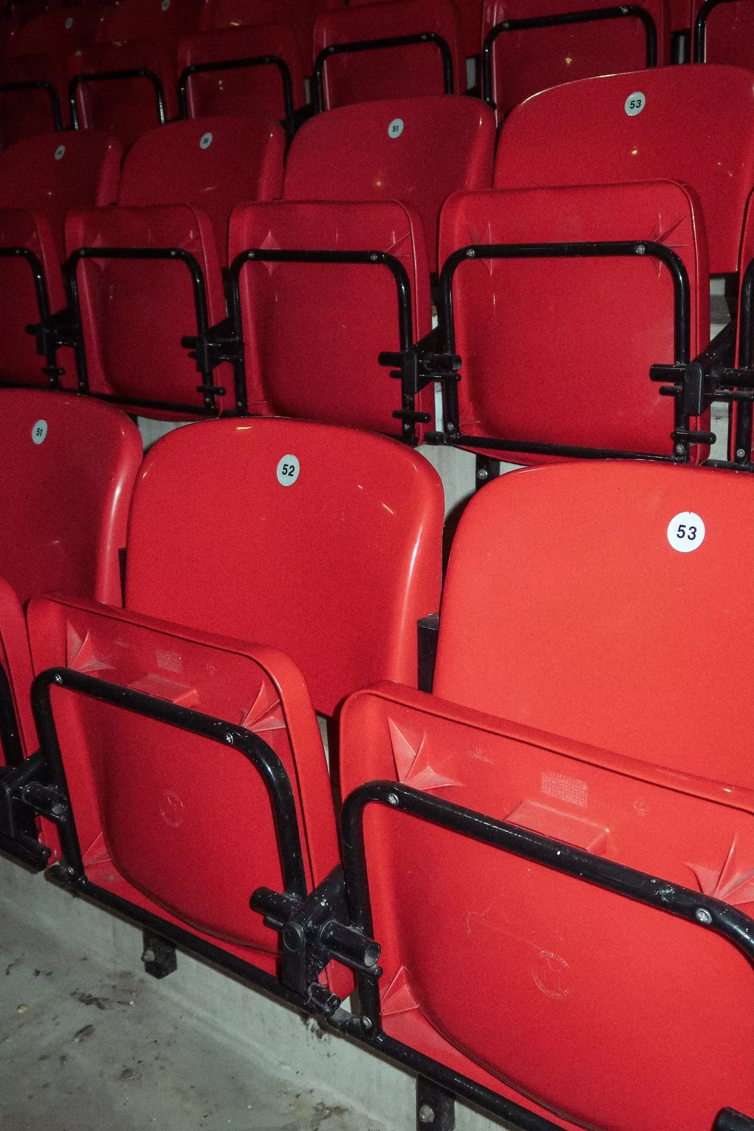 Row of red seats inside Old Trafford football stadium