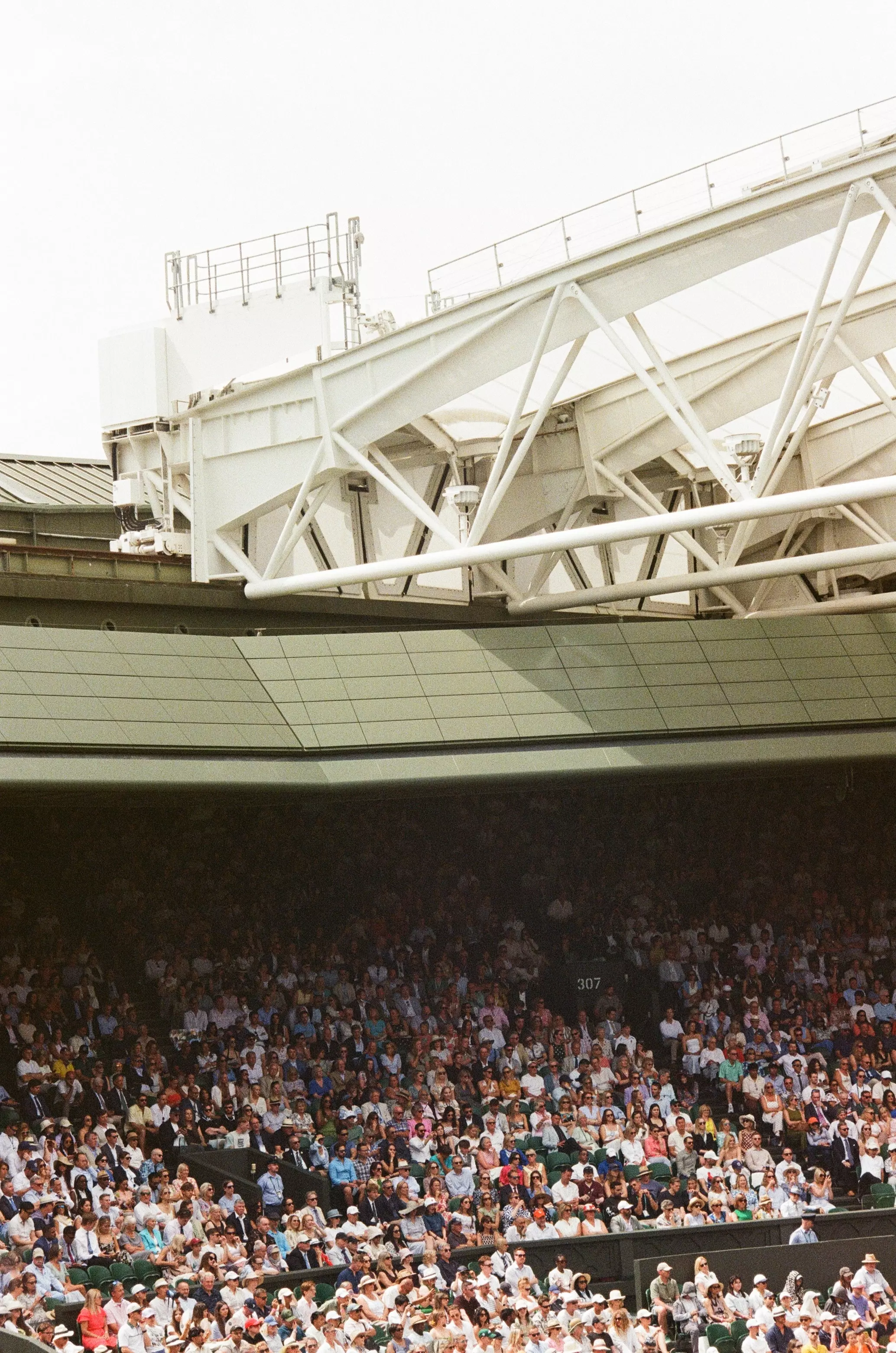 Centre Court, Day One at Wimbledon with the crowd sat in their seats under the roof