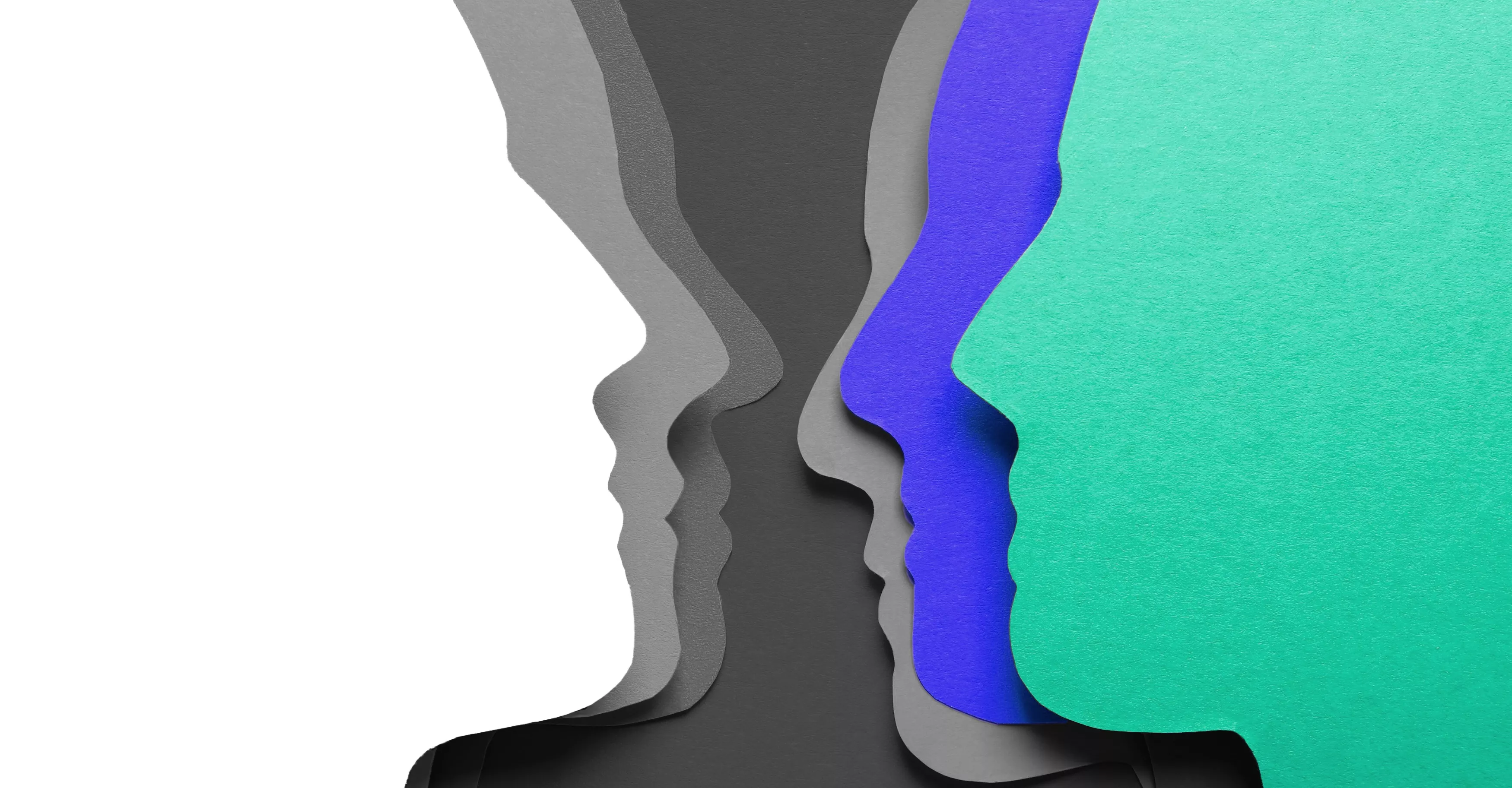 Bunch of paper heads cut out and staggered amongst eachother