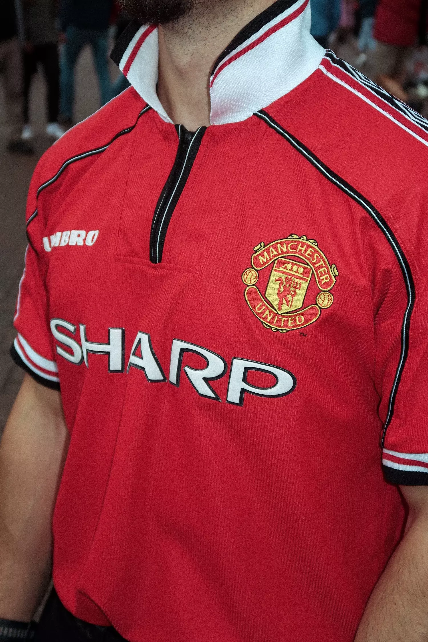 Close up of the front of a vintage Manchester United Umbro shirt
