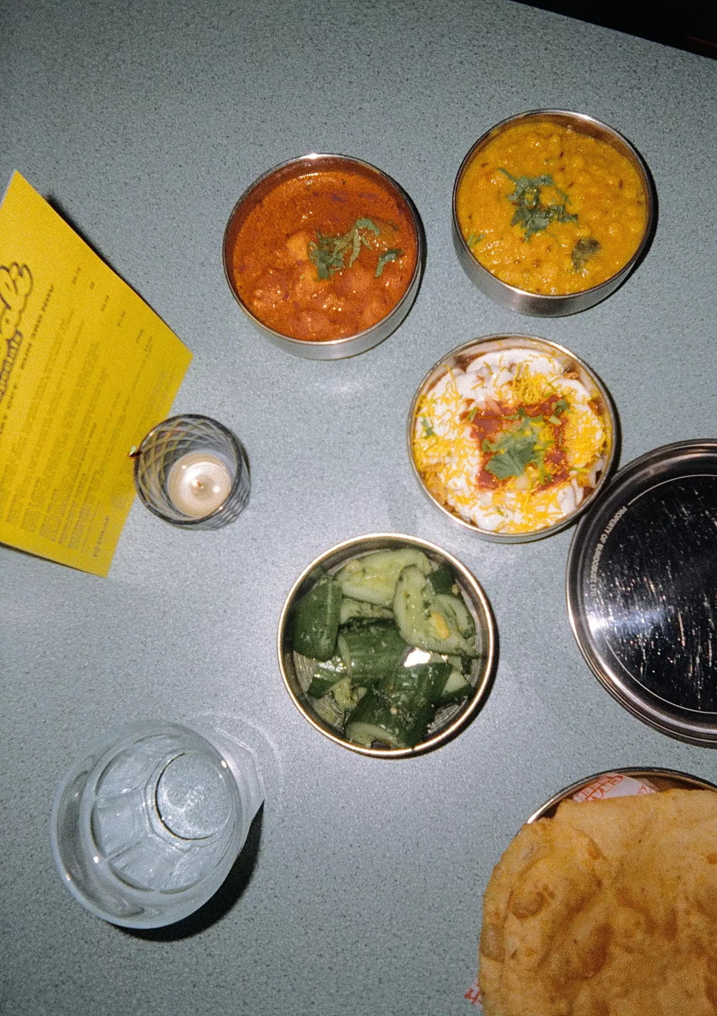 Flash photo overhead shot of dishes from Bundobust on a table