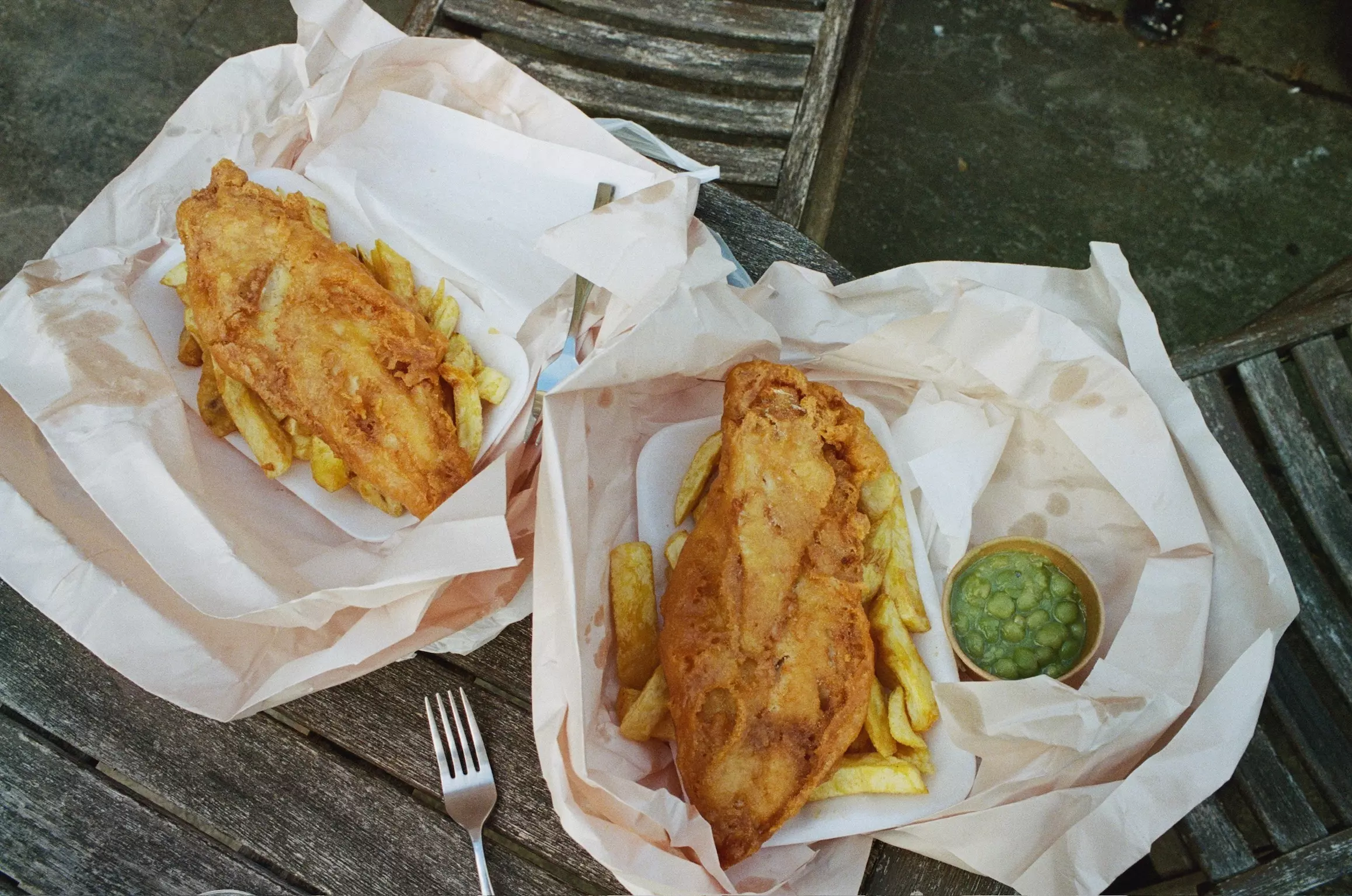Fish and Chips on an outside table with Mushy Peas