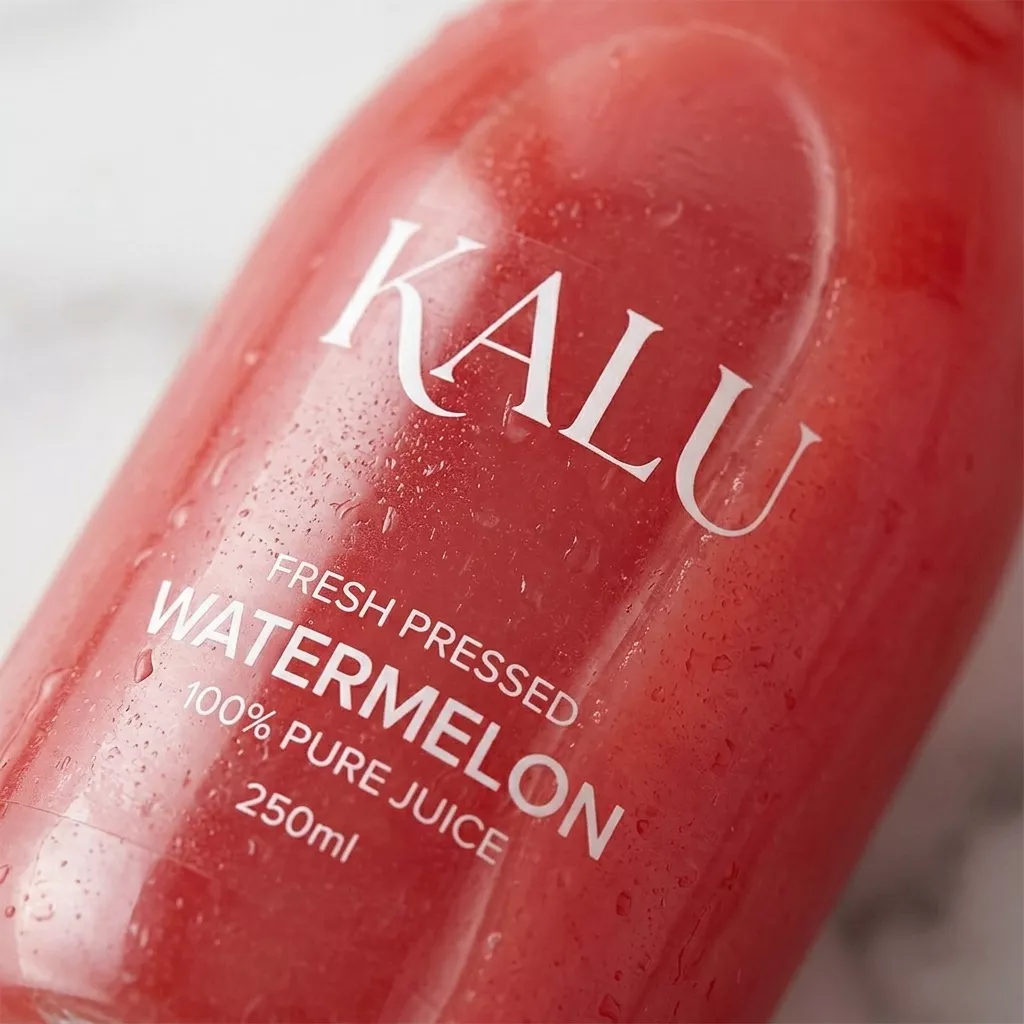 Close up detail of direct print on clear PET juice bottle for Fern Press brand