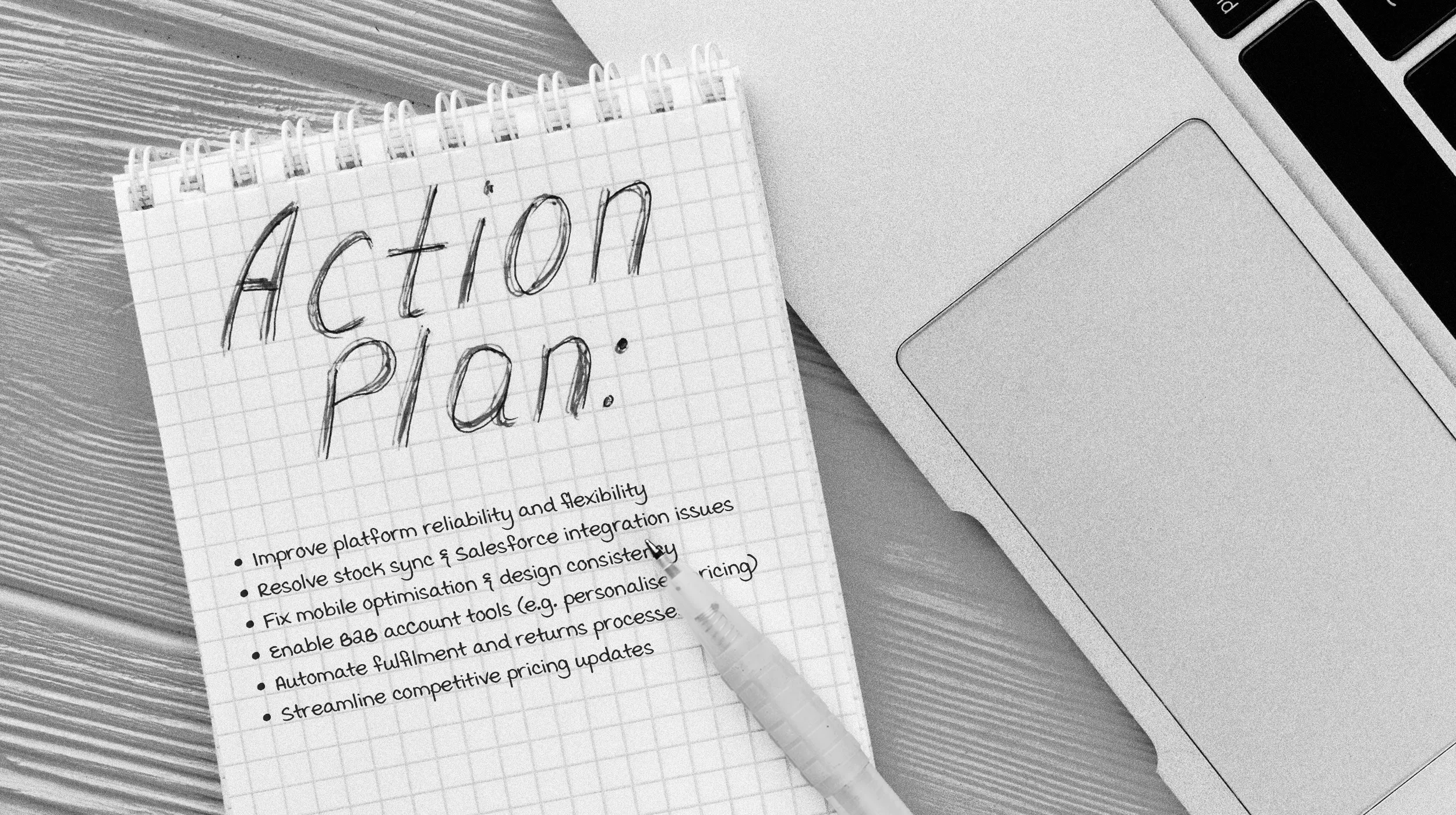 Black and White close up of a notepad with an ecommerce action plan