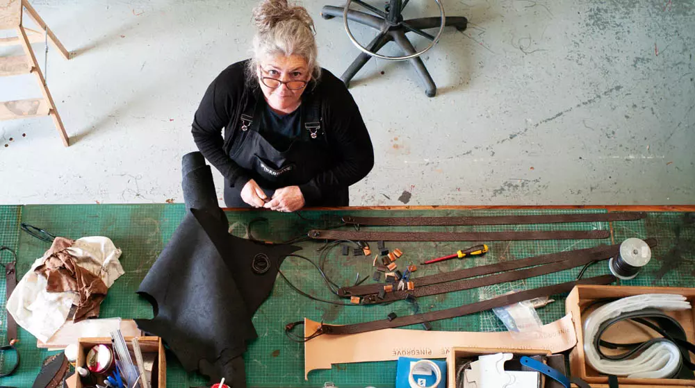 L working at Pinegrove Leather.jpg