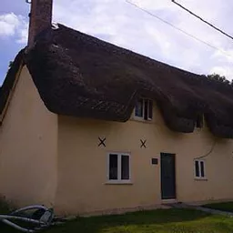 House painted with pure white limewash and a raw sienna pigment.