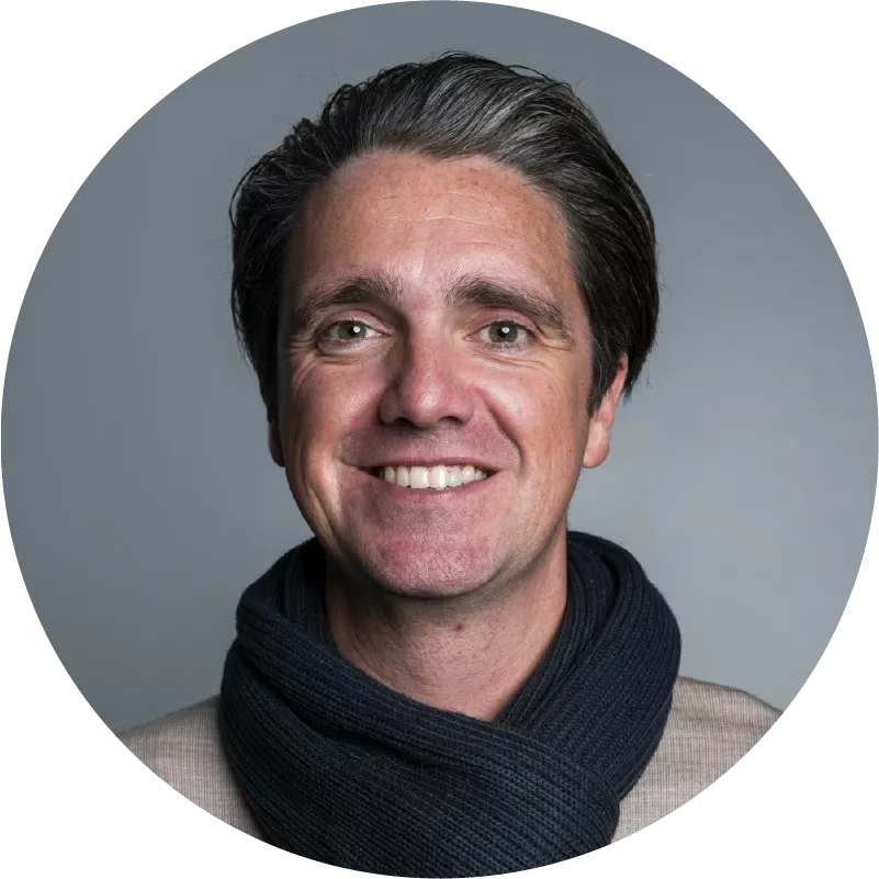 Circle headshot of Matt Smith, CEO of Symphony Commerce