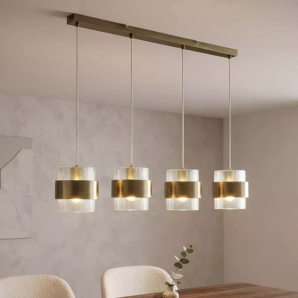 Image of a bar pendant over a dining table for the blog Kitchen Lighting for Trade: How to Build a Collection That Sells