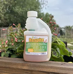 AgriVite Respite 250ml Container Next To Flowers