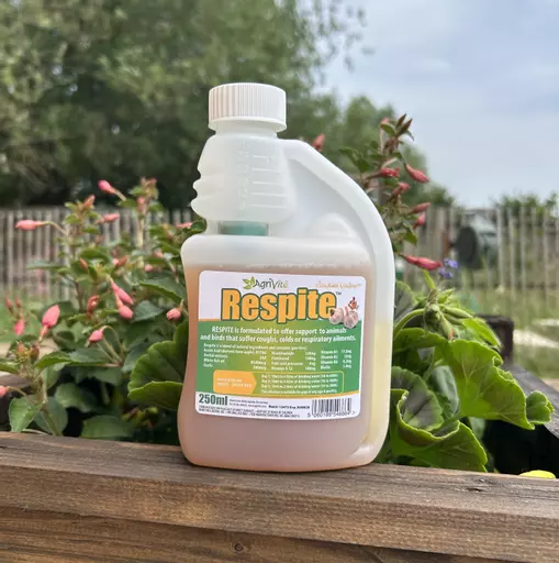 AgriVite Respite 250ml Container Next To Flowers