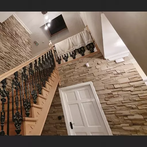 A view of Vintage Ledgestone Mojave 19 on a interior stairs wall
