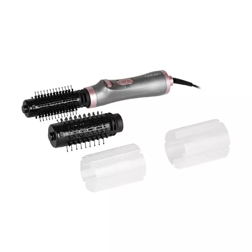 Rotating dryer outlet brush