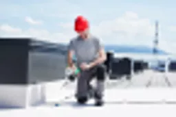 Lesiter ST Heat Gun in use on a roof.webp