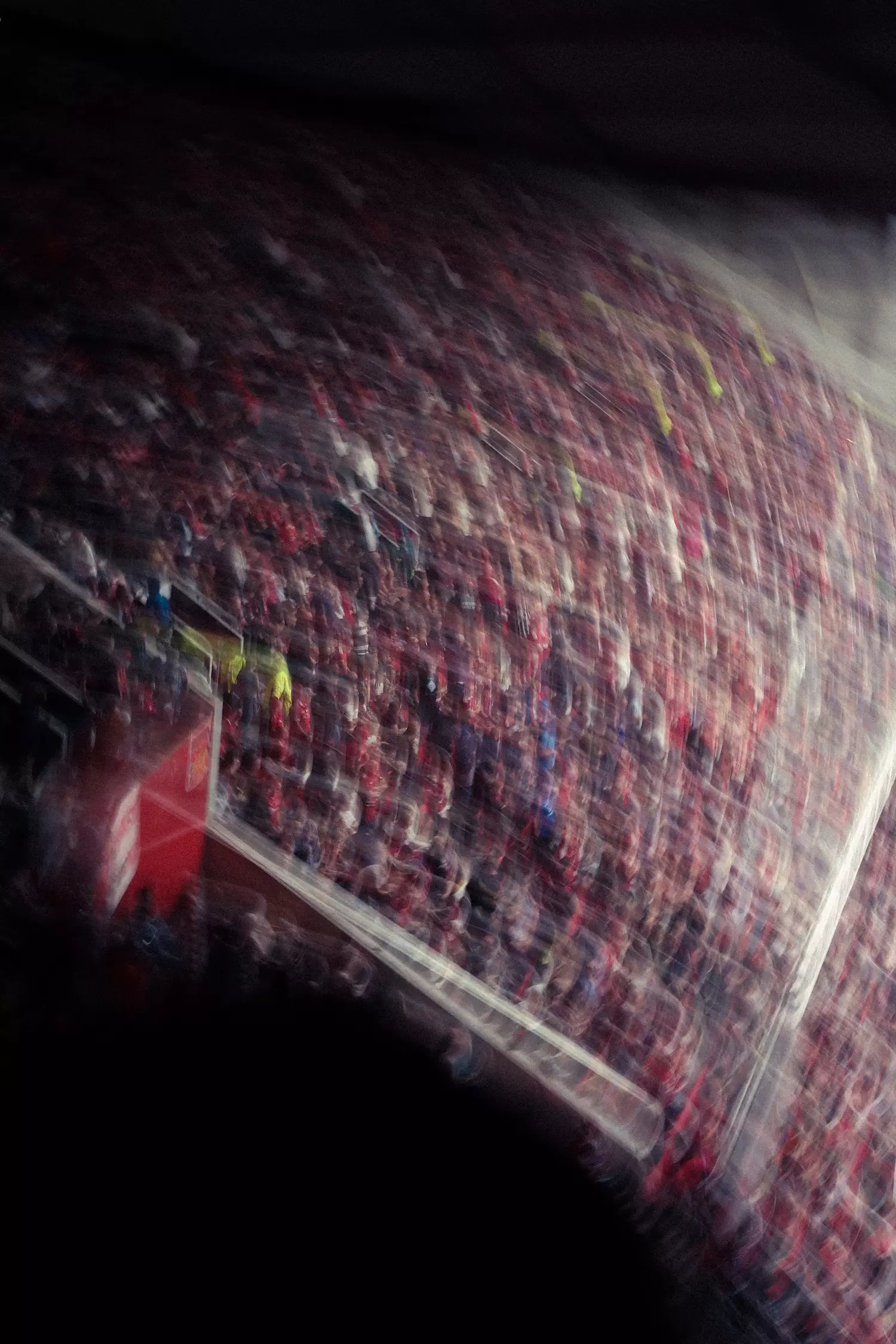 Blurry photo of inside Old Trafford football stadium of the crowd