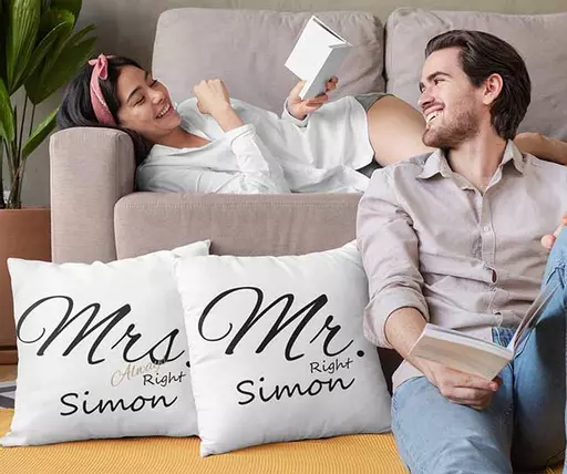 Matching humorous marriage cushions with personalised couple names