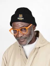 beanie-mockup-featuring-an-ai-created-bearded-senior-man-posing-in-a-studio-with-a-happy-look-m54874.png